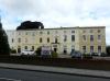 two terraced houses (9 bays) built circa 1820-50 with extension to right circa 1960-80
