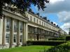 terrace of 12 houses built in 1832-48 with later additions and alterations, designed by Edward Jenkins and by J B Papworth