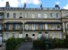 terrace of 12 houses built in 1832-48 with later additions and alterations, designed by Edward Jenkins and by J B Papworth