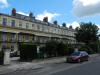terrace of 12 houses built in 1832-48 with later additions and alterations, designed by Edward Jenkins and by J B Papworth