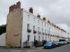 terrace of 11 houses and attached railings. circa 1834 with later alterations