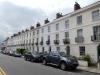terrace of 11 houses and attached railings. circa 1834 with later alterations