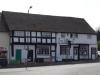 built in the 17th century with 19th and 20th century alterations; timber-frame and plaster