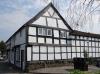 built in the 17th century with 19th and 20th century alterations; timber-frame and plaster