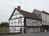 house built in the 16th century; timber-frame and render, over rendered ground floor