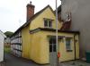 cottage built in the 17th century; timber-frame and render