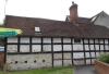 cottage built in the 17th century; timber-frame and render