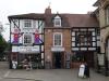 built in the 17th , 18th and 20th centuries; timber-frame and render, 18th century brick to centre