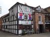built in the 17th , 18th and 20th centuries; timber-frame and render, 18th century brick to centre