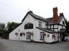 house, later inn built in the 16th century with 19th century additions; timber-frame and plaster