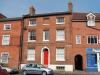 house built in the early 19th century with later additions and alterations