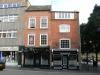 2 timer-framed houses built in the 16th or 17th century, refaced in the late 18th century, shop fronts are mid 19th century