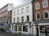 built pre-1560, when owned by Robert Yowle, merchant, extended in 1578, with later additions and alterations including 1970s shop front