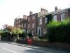 part of a row of 7 houses built circa 1830 with later additions and alterations