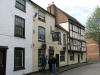 2 timber frame houses built in the 16th century, upper storey added circa 1666-78, refenestrated in 19th century, later additions and alterations