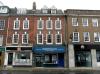 house built in the mid 18th century with later additions and alterations including 1970s shop front