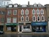 built in the early-mid 18th century with later additions and alterations, including 1920s and 1970s shop fronts and attic dormers