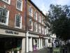 built in the early 18th century with origins in the mid 17th century withlater additions and alterations including circa 1990s shop front
