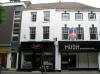 house built in the mid 18th century with later additions and alterations including 1970s shop front