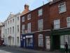 pair of terraced houses build in the early to mid 19th century with later additions and alterations