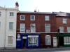 pair of terraced houses build in the early to mid 19th century with later additions and alterations