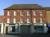 built in the mid-late 18th century with later additions and alterations including circa 1980s shop fronts