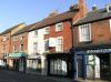 2 houses built in the early 19th century with later alterations including the shop fronts circa 1970s