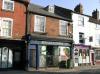 built in the early 19th century with later additions and alterations including late 19th century shop front
