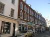 built in 1765 with later additions and alterations, occupied by Julie Drew Hair (8) and St Richard's Hospice (7)
