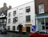 timber-framed house thought to date from circa 1550, early-mid 18th century facade with later additions and alterations