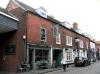 probably built circa 1801 for James Durnford, with earlier origins and later alterations and additions including 19th century shop fronts