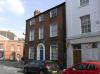 house built in the early 19th century with later additions and alterations