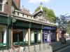 4 shops built in the late 19th century with later additions and alterations including shop fronts circa 1980s