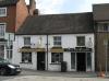 house built in the 16th or 17th century, with later additions and alterations including mid 19th century facade
