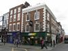 house built circa 1720 with later additions and alterations including 1960s attic dormers and 1980s shop front
