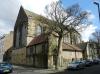 former parish church built in 1876-78, designed by E G Paley and H J Austin