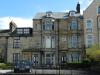 3 houses built in the early-to-mid C19 with late C19 alterations and additions, shares lead hopperhead with 336 dated 1828